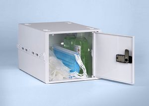 A white lockable box storing Coronavirus PPE such as hand sanitiser face masks and latex gloves