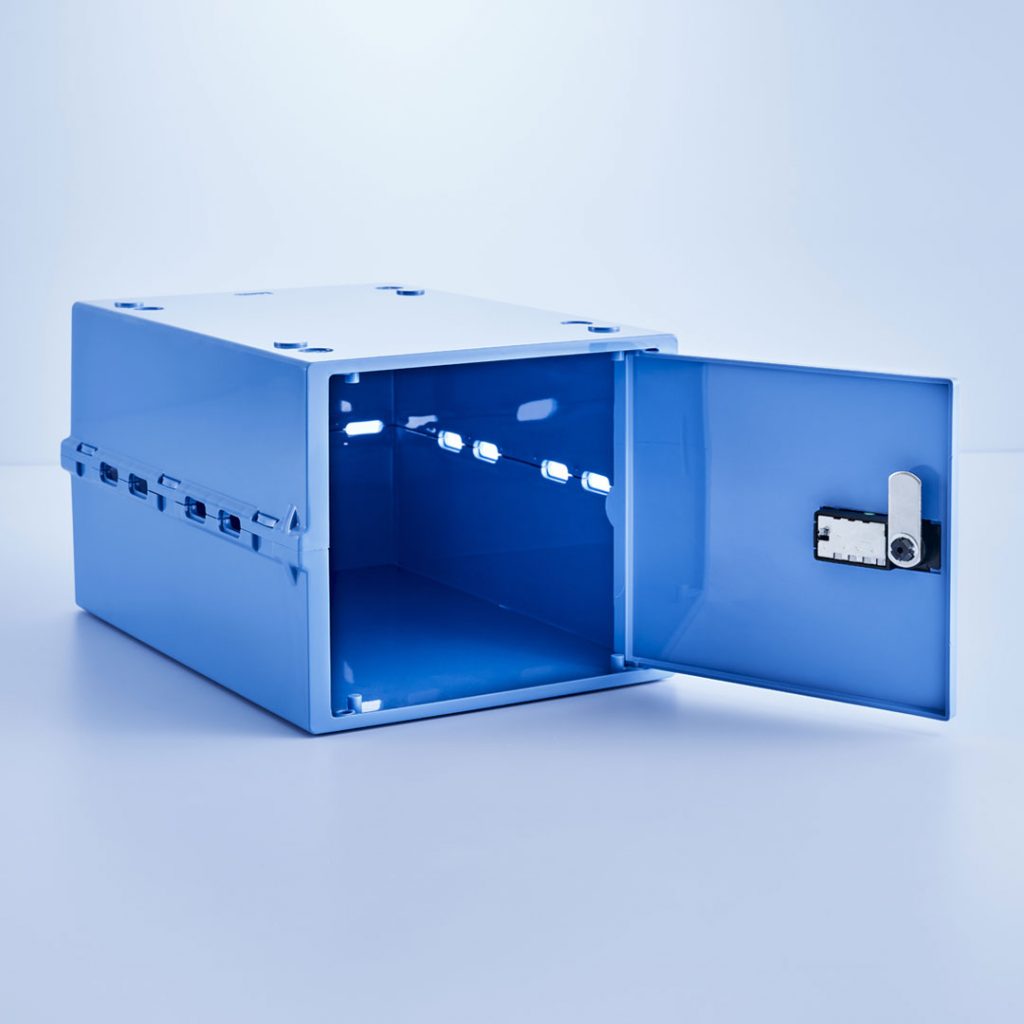 Blue medication safe shown with combination lock door open.