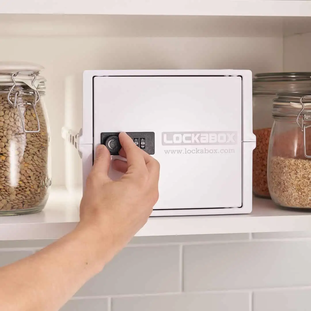 person using opal white lockable box in kitchen